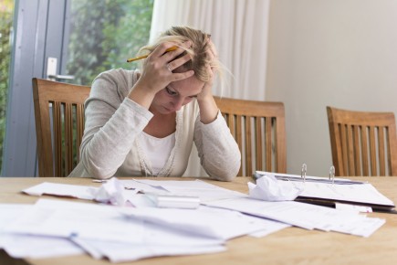 iStock-185782615 Woman in debts.jpg